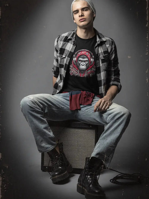 Black and red plaid flannel shirt with a graphic tee underneath
