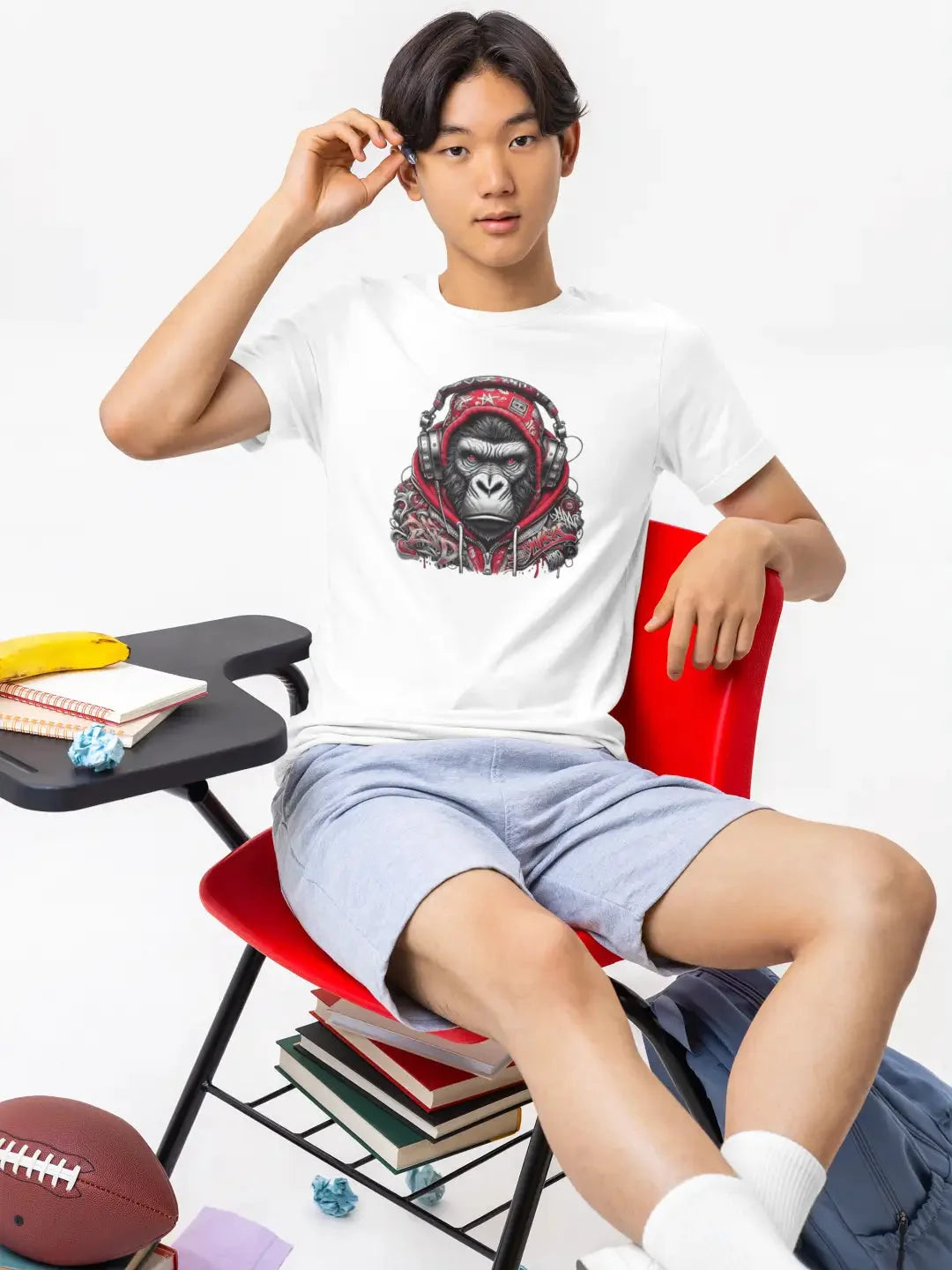 White t-shirt with graphic design of a gorilla wearing headphones, casual wear suitable for everyday use