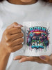 White ceramic mug with ’Born to Game’ graphic