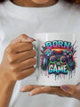 White ceramic mug with ’Born to Game’ graphic