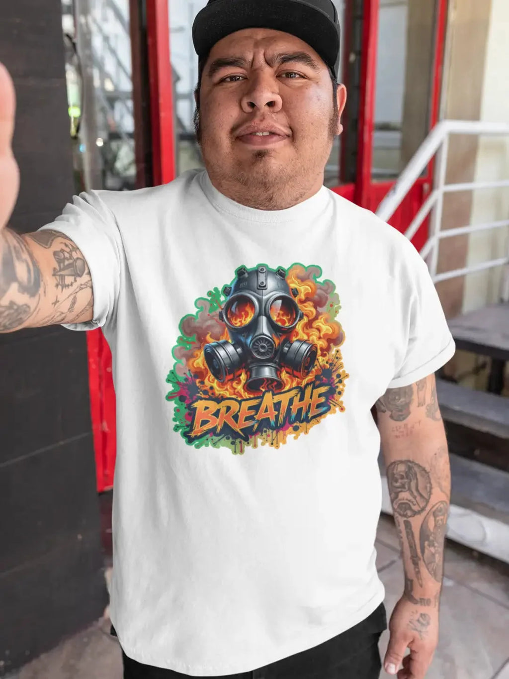 White short-sleeved t-shirt with a graphic of a gas mask surrounded by flames and the word ’BREATHE.’