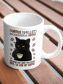 White ceramic coffee mug with a black cat design
