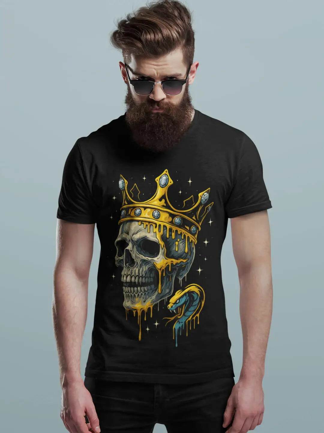 Black crewneck t-shirt with a graphic of a crowned skull dripping gold and a snake
