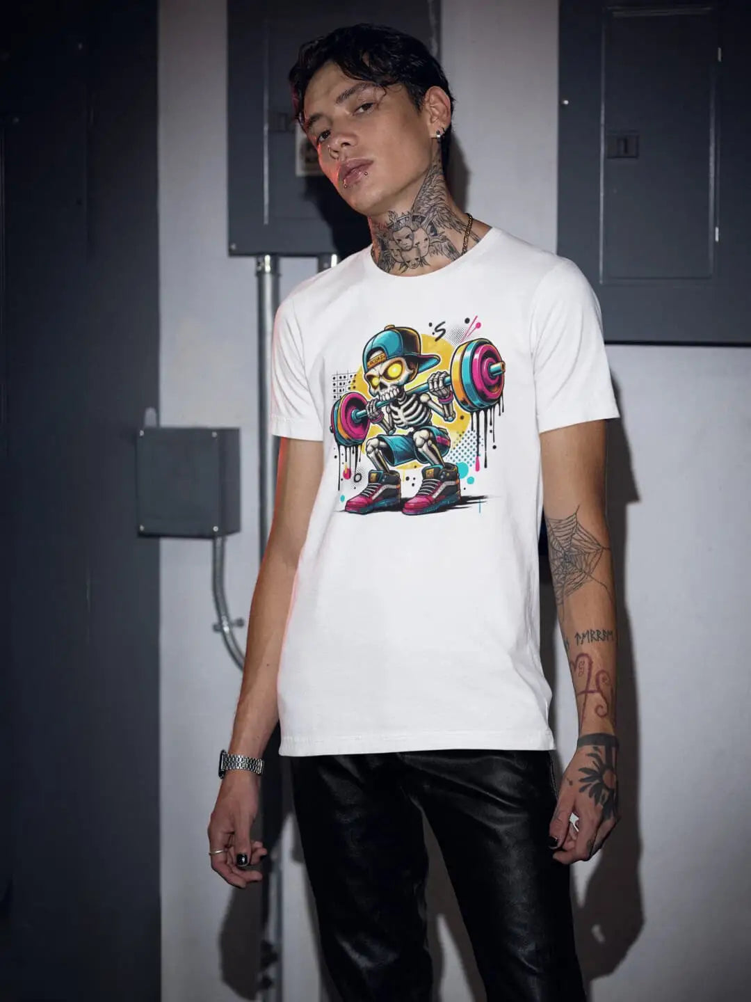 White graphic t-shirt with a colorful cartoon skeleton lifting weights