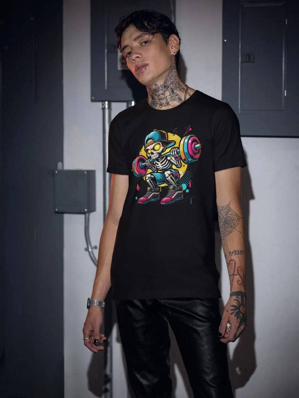 Black short-sleeved t-shirt with a colorful skeleton lifting weights graphic