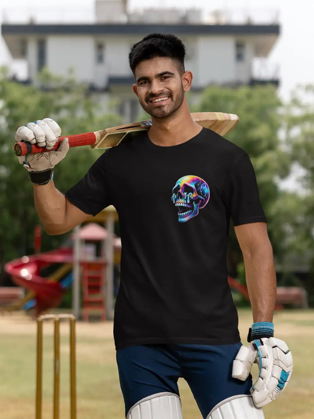 A black t-shirt with a colorful skull graphic on the left chest.