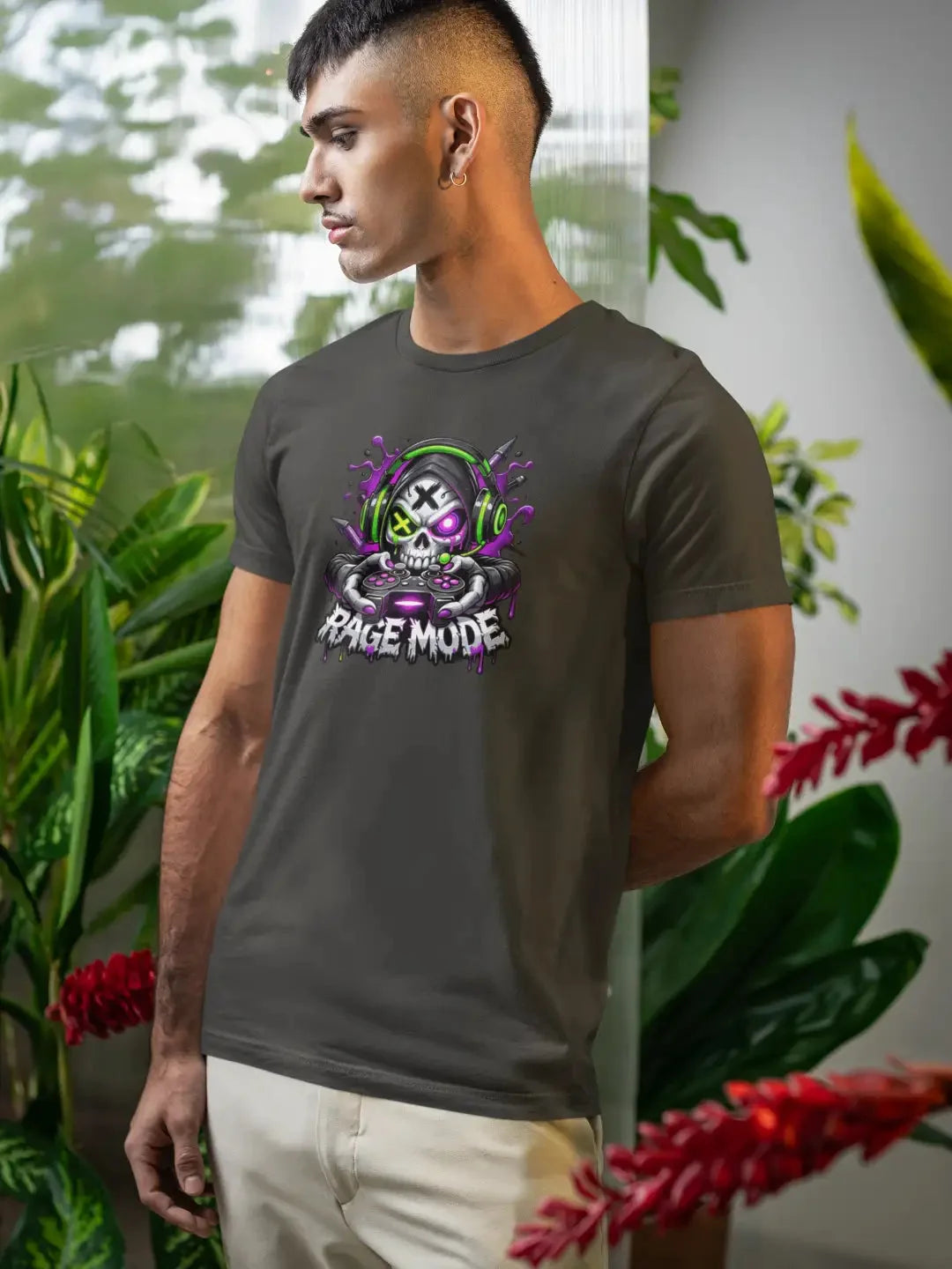 Dark gray cotton t-shirt featuring a vibrant graphic of a skull wearing green headphones and holding a controller, with the text ’rage mode’ below in stylized lettering