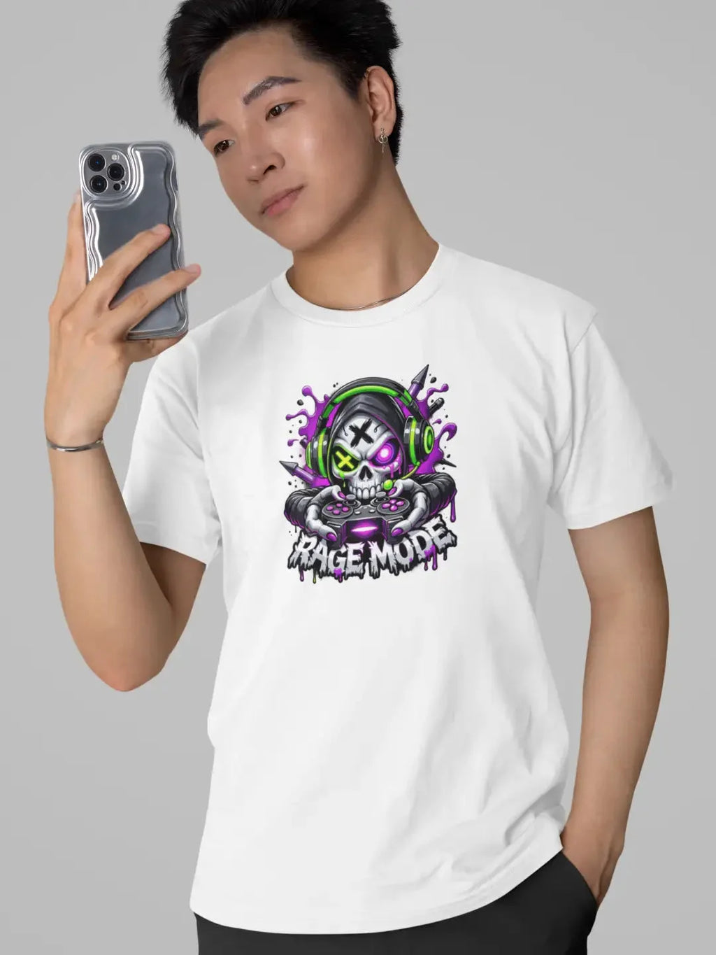 White cotton t-shirt featuring a vibrant graphic of a skull wearing green headphones and holding a purple gaming controller with the text ’rage mode’ below it