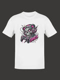 White cotton t-shirt featuring a vibrant graphic of a skull wearing pink headphones and holding a game controller, with the word ’gamer’ in stylized pink lettering